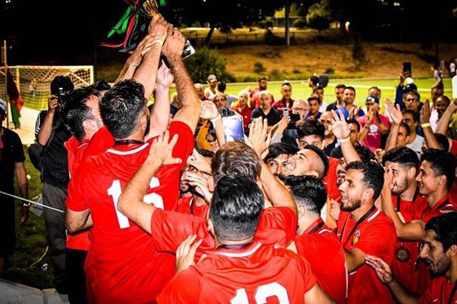 Lifting the trophy together